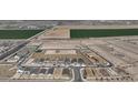 Aerial view of a developing community, showcasing newly built homes near agricultural fields at 24187 W Agora Ln, Buckeye, AZ 85326