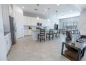 Open kitchen with white cabinets, stainless steel appliances, and a large island at 24478 N 166Th Ave, Surprise, AZ 85387