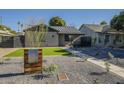 Charming home featuring manicured landscaping, gravel, a mailbox, and a walkway leading to the entrance at 2719 N Greenfield Rd, Phoenix, AZ 85006