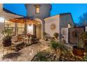 Inviting courtyard with comfortable seating, decorative accents, and lush plants creating a serene outdoor space at 31061 N 136Th Ln, Peoria, AZ 85383