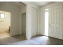 Bright entryway featuring tile flooring and an open doorway leading to another room at 3864 W Fairway Dr, Eloy, AZ 85131