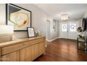 Elegant entryway with hardwood floors, modern chandelier, and stylish decor at 4225 N 42Nd St, Phoenix, AZ 85018