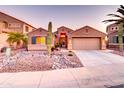 Charming single-story home with a well-manicured rock yard, desert landscaping, and a two-car garage at 42829 W Oakland Dr, Maricopa, AZ 85138