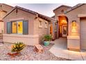 Close up of a charming home's entrance showcasing well manicured front yard and inviting doorway at 42829 W Oakland Dr, Maricopa, AZ 85138