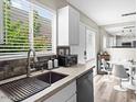 Bright kitchen featuring stone backsplash, stainless steel appliances and a kitchen sink at 4610 N 68Th St # 416, Scottsdale, AZ 85251