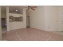 Open floor plan of the living room with tile flooring adjacent to the kitchen area at 655 W Mission Dr, Chandler, AZ 85225