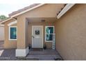 Close up of the front door, showing Welcome sign, security door, and well maintained front porch at 853 E Ross Ave, Phoenix, AZ 85024