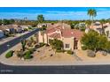 Charming stucco home featuring well-kept desert landscaping and a beautiful red tile roof at 9160 E Wethersfield Rd, Scottsdale, AZ 85260