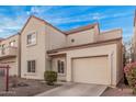 Charming two-story townhome featuring a front-facing garage and low-maintenance gravel landscaping at 1018 W Libra Dr, Tempe, AZ 85283