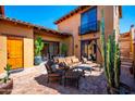 Inviting outdoor patio featuring comfortable seating, lush plants, and a cozy ambiance at 10597 E Rising Sun Dr, Scottsdale, AZ 85262
