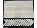 Close up on tile samples with multiple shades and patterns at 18364 W Navajo St, Goodyear, AZ 85338