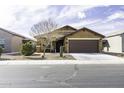 Charming single-story home with desert landscaping, a cozy front porch, and a convenient two-car garage at 1973 N Lewis Pl, Casa Grande, AZ 85122