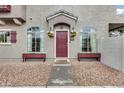 Home featuring a welcoming entrance with flower boxes and arched windows at 2402 E 5Th St # 1742, Tempe, AZ 85288
