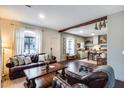 Inviting living room with hardwood floors, natural light, and kitchen in the background at 2402 E 5Th St # 1742, Tempe, AZ 85288