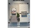 A design board showcasing the interior finishes, including tile, carpet, counter and cabinet samples for the new home at 25330 W Bowker St, Buckeye, AZ 85326