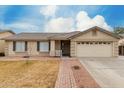 Charming single-level home featuring a tile roof and a well-maintained front yard at 2975 E Tulsa St, Gilbert, AZ 85295