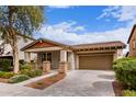Beautiful single-story home featuring mature landscaping, a spacious driveway, and a two-car garage at 3143 N Evergreen St, Buckeye, AZ 85396