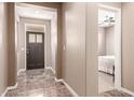 Welcoming foyer boasts sleek flooring and neutral paint creating an inviting atmosphere at 3143 N Evergreen St, Buckeye, AZ 85396