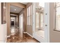 Bright and airy hallway showcases elegant flooring, connecting various living spaces at 3143 N Evergreen St, Buckeye, AZ 85396