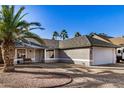 Landscaped front yard with mature trees and a charming one-story home at 4813 W Milky Way, Chandler, AZ 85226