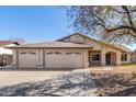 Inviting single-story home with three-car garage and mature tree at 5025 N 85Th Dr, Glendale, AZ 85305