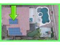 Aerial view of a home with a pool, putting green, playground, and solar panels at 9867 S 182Nd Dr, Goodyear, AZ 85338