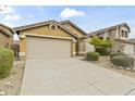 Single-story home with a spacious driveway and low maintenance desert landscaping at 10226 E Pine Valley Rd, Scottsdale, AZ 85255