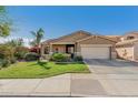 Charming single-story home with manicured front lawn and desert landscaping at 10359 E Jacob Ave, Mesa, AZ 85209