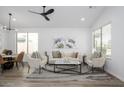 Bright, airy living room with modern decor and stylish ceiling fan at 1280 E Redwood Dr, Chandler, AZ 85286