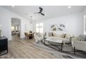 Open-concept living room featuring a dining area and modern furnishings at 1280 E Redwood Dr, Chandler, AZ 85286
