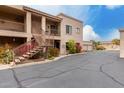 Charming condo exterior with stairs and desert plants, plus access to garages at 13644 N Saguaro Blvd # 103, Fountain Hills, AZ 85268