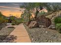 Eagles Nest entrance sign with desert landscaping and walking path leading to the community at 16856 N Mountain Pkwy, Fountain Hills, AZ 85268