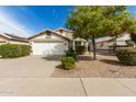 Single Gathering home with a well-maintained lawn, beautiful desert landscaping and a two-car garage at 20615 N 105Th Ave, Peoria, AZ 85382