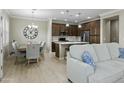 Cozy living room blending into dining and kitchen spaces with a large sectional sofa at 2477 W Market Pl # 18, Chandler, AZ 85248