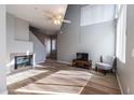 Bright living room features hardwood floors, fireplace, ceiling fan, and ample natural light at 3633 N 3Rd Ave # 2016, Phoenix, AZ 85013
