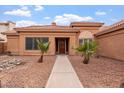 Charming single-story home with desert landscaping, and a red tile roof at 3913 E Goldfinch Gate Ln, Phoenix, AZ 85044