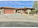Beautiful single-story home with stone accents, a tile roof, a multi-car garage, and mature landscaping at 4116 E Sierra Sunset Trl, Cave Creek, AZ 85331