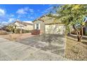 Inviting single-story home with landscaped front yard and attached two-car garage at 4240 W Crossflower Ave, San Tan Valley, AZ 85144