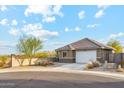 Single-story home showcasing a tile roof, neutral stucco, and a two-car garage on a cul-de-sac at 431 W Guinea Ct, Casa Grande, AZ 85122