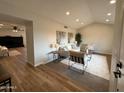 Open living room with neutral colors, recessed lighting, and modern decor at 4524 W Larkspur Dr, Glendale, AZ 85304