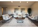 Comfortable living room with a neutral palette, a round wood coffee table, and recessed lighting at 4524 W Larkspur Dr, Glendale, AZ 85304