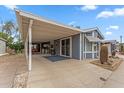 Relaxing covered patio with furniture, slider access, and desert landscaping at 5735 E Mcdowell Rd # 147, Mesa, AZ 85215