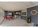 View of the covered patio with furniture, bar, and decorative accents at 5735 E Mcdowell Rd # 147, Mesa, AZ 85215