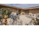 Relaxing backyard patio with outdoor seating, desert landscaping, and shade for comfortable living at 9862 N Balboa Dr, Sun City, AZ 85351