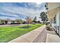 Beautiful community lawn, perfect for relaxation and recreation, with well-maintained landscaping at 10350 W Deanne Dr, Sun City, AZ 85351