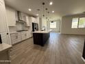 Bright, open kitchen boasts modern appliances and a large island, perfect for entertaining at 13342 W Lariat Ln, Peoria, AZ 85383