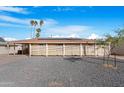 Charming single-story home featuring desert landscaping, solar panels and a private front patio at 1434 N Casa Grande Ave, Casa Grande, AZ 85122