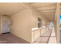 Inviting covered porch with brick siding, security door, and well-maintained exterior at 1434 N Casa Grande Ave, Casa Grande, AZ 85122