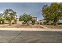 Charming single-story home showcasing a meticulously landscaped front yard at 16118 W Vista North Dr, Sun City West, AZ 85375