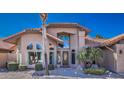 Attractive front entry showcasing desert landscaping and a decorative front door at 16402 N 48Th Way, Scottsdale, AZ 85254